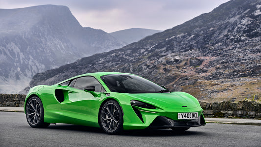 Green McLaren Artura on country road