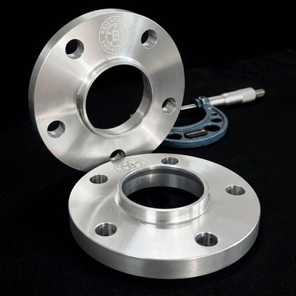 Pair of Brightstone Engineering hubcentric wheel spacers, CNC machined billet aluminium, shown with a precision micrometer