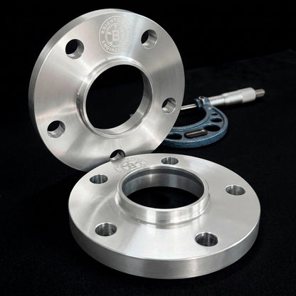 Pair of Brightstone Engineering hubcentric wheel spacers, CNC machined billet aluminium, shown with a precision micrometer