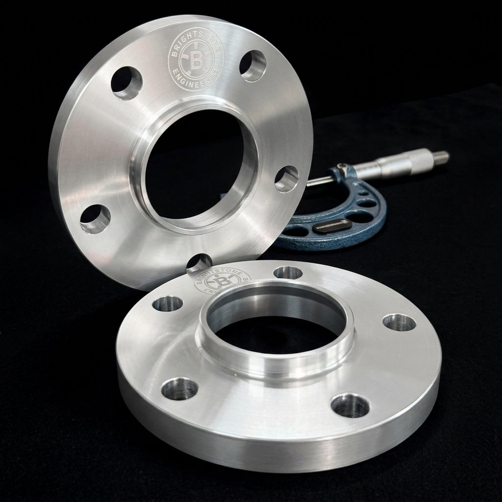 Pair of Brightstone Engineering hubcentric wheel spacers, CNC machined billet aluminium, shown with a precision micrometer