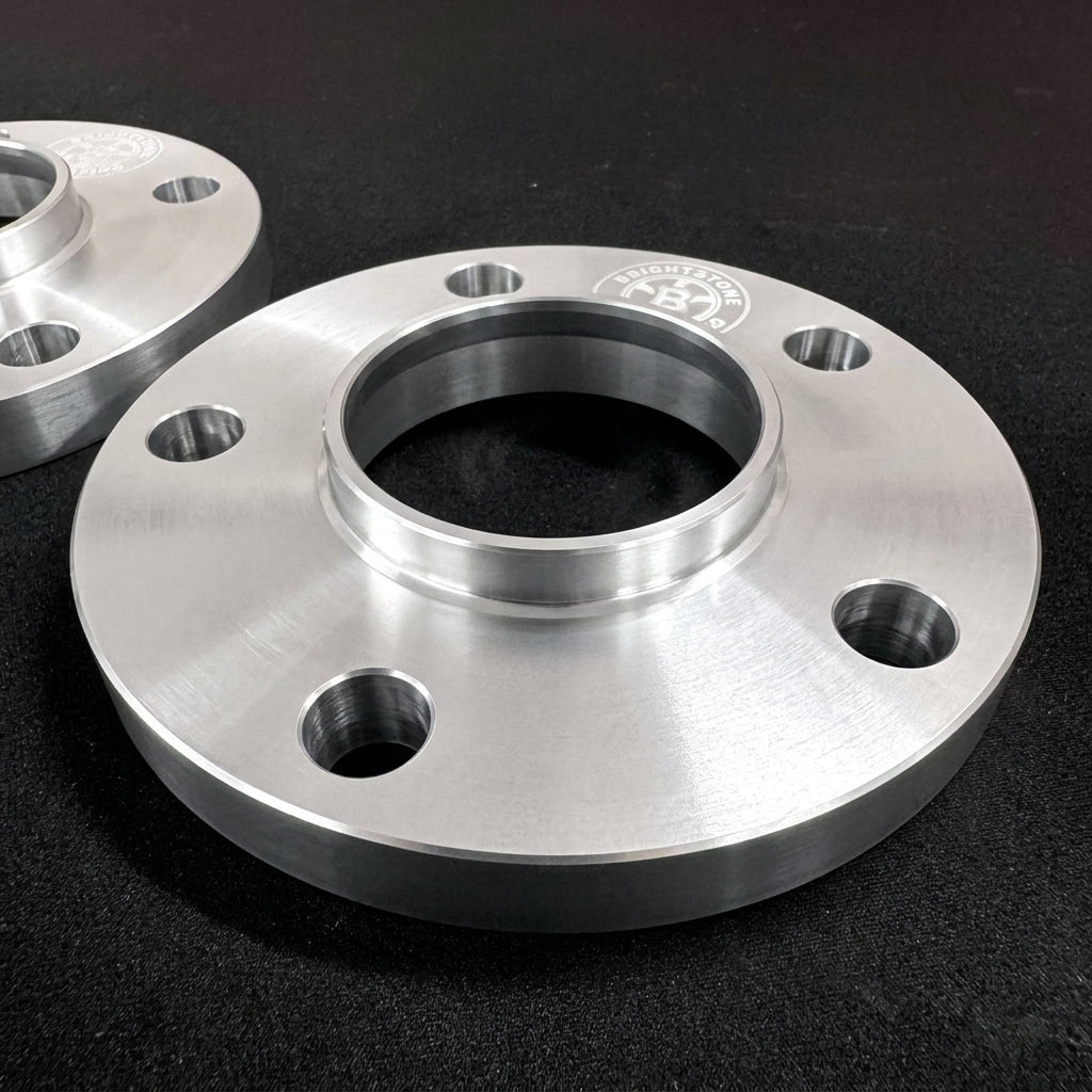 Second angle of a Brightstone Engineering wheel spacer showing the machined bore and bolt clearance holes